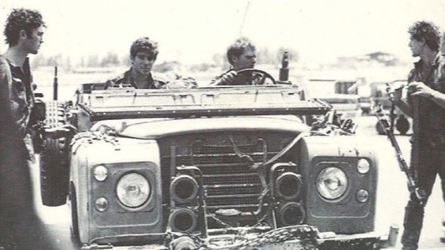 Israeli commandos with one of the Land Rovers used in the operation